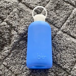 BKR glass water bottle with blue plastic covering